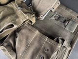 many different types of military pants laid out on a table