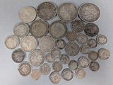 a lot of coins that are on the table