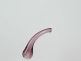 a glass vase with a purple handle on a white table