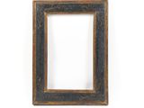 an old picture frame on a white wall with a white background