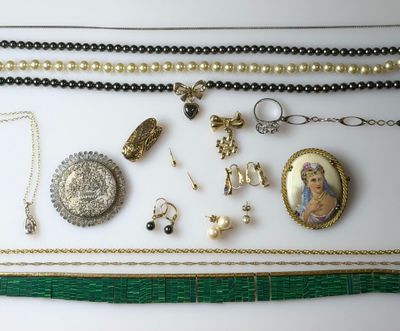 a close up of a bunch of jewelry on a table