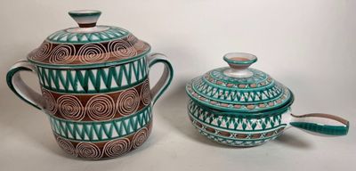 a tea pot and a teapot sitting next to each other on a table