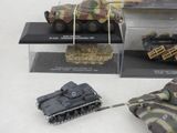 four different models of military vehicles on display