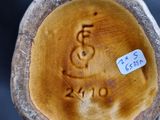 a close up of a piece of wood with a sticker on it