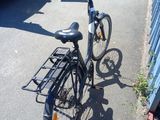 a bicycle that is parked on the side of the street