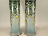 two vases that are sitting on a table