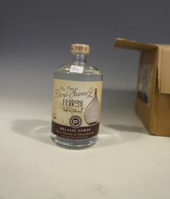 a bottle of liquor sitting next to a cardboard box