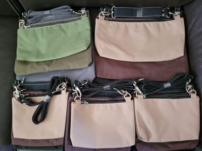 six purses in the back of a car