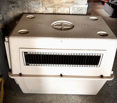 a white stove sitting in a room next to a brick wall