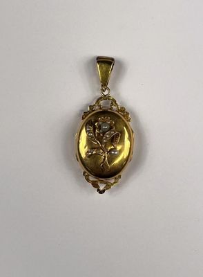 an image of a gold locke with a picture of a woman on it