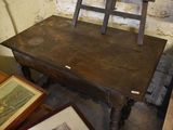 a wooden chair sitting on top of a wooden table