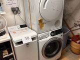 a washer and dryer in a small room