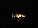 an image of a gold ring on a black surface