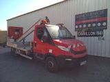 a red truck that is parked in front of a building