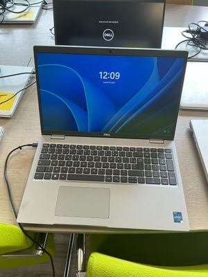 two laptops that are sitting on a table