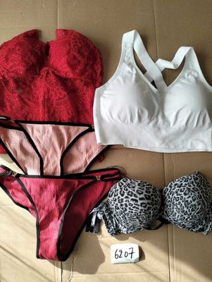 two bras and panties on a cardboard box with a price tag