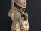 an image of a statue of a man holding a knife and a dog