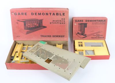 two boxed boxes of train tracks and a remote control device