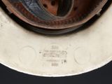 a close up view of a metal bowl with a lid