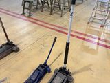 two jacks that are sitting on the floor in a warehouse