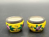 pair of yellow and pink flowered glass salt and pepper shakers