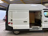 a white van with its doors open in a garage