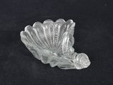 a close up of a glass bowl on a black surface