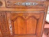 a wooden cabinet that has a door on it