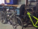 many bikes that are parked in a garage