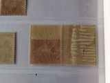 four different types of stamps on a sheet of paper