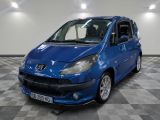 a picture of a blue car parked in a garage