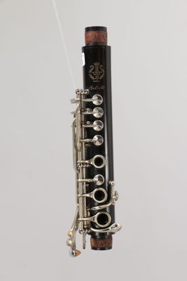 a close up of a clarinet with a string attached to it