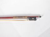 a red and black violin bow and a black and white violin stick