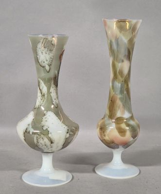 two vases sitting side by side on a table