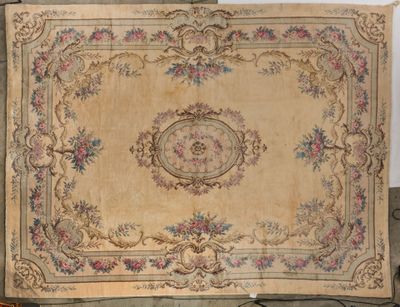 an old rug with a floral design on it on a table