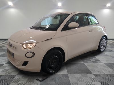 a picture of a small white car parked in a garage