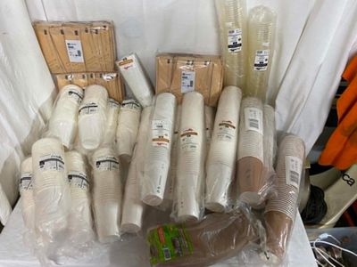 many rolls of yarn and other items on the table