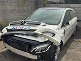 an image of a car that has been badly damaged