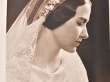 a black and white photo of a woman in a wedding dress
