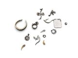 many different types of ear piercings on a white surface