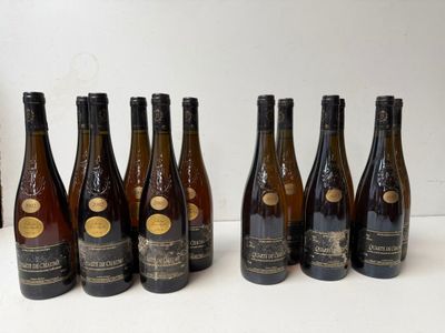 six bottles of wine lined up in a row on a table
