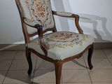 a chair that is sitting on a tile floor
