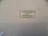 an image of a close up of a vase with a label on it