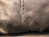 a close up of a purse on a table