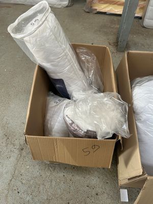 a cardboard box full of items that are sitting on the floor