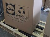 a cardboard box sitting on a pallet in a warehouse
