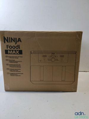 a box of food sitting on top of a table next to a white wall