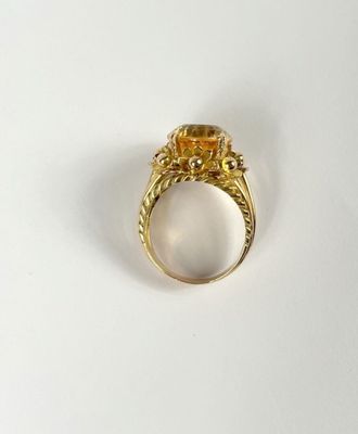 an image of a gold ring with a citrine stone in it