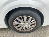 a white car that has a flat tire on it