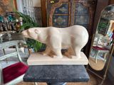 a statue of a polar bear on top of a table